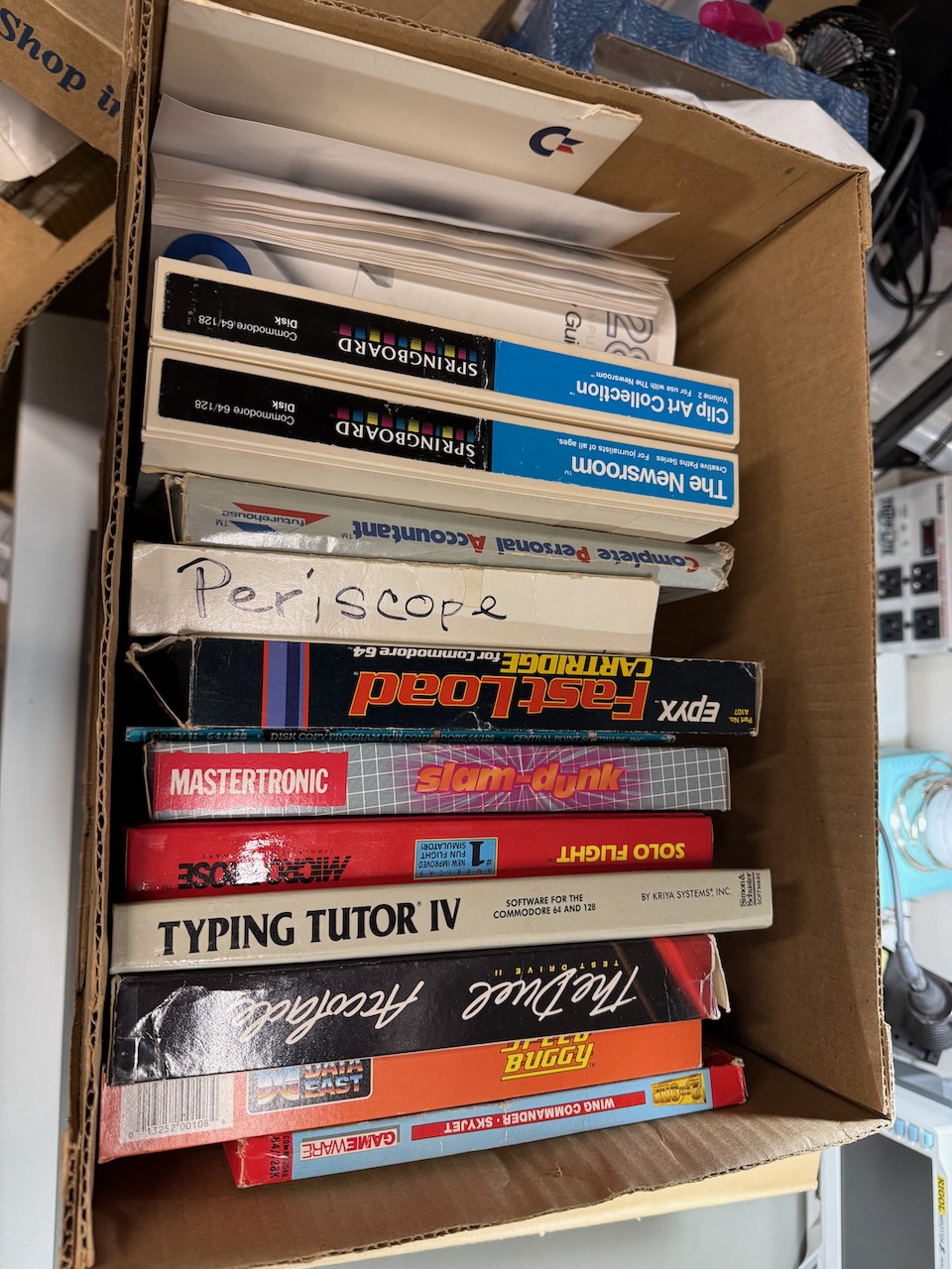 A set of C64 software with boxes and manuals