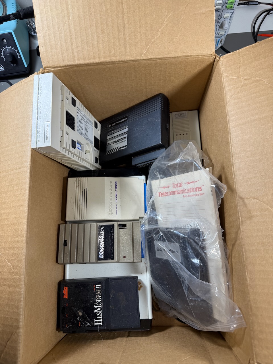 More modems in the box: Commodore Automodem, Commodore modem/1200, MasterModem, HesModem II, and others