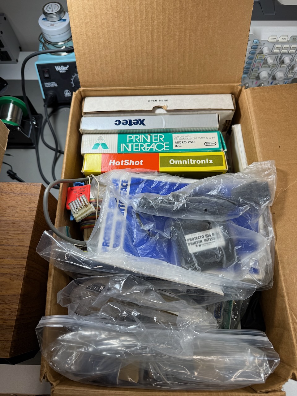 A box of Commodore printer interfaces from various manufacturers