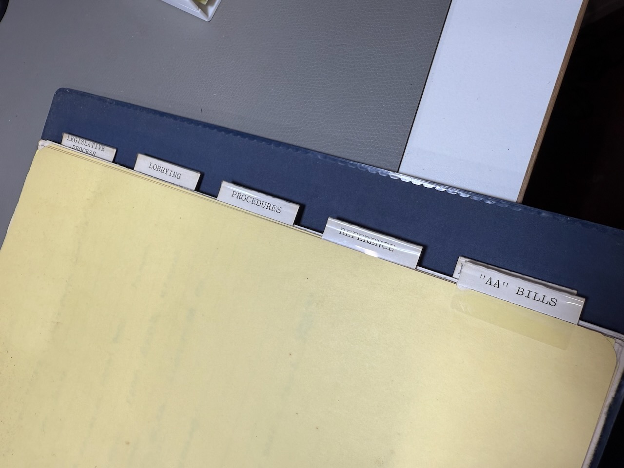 UWCUG documentation binder tabs: Legislative Process, Lobbying, Procedures, Reference, 'AA' Bills