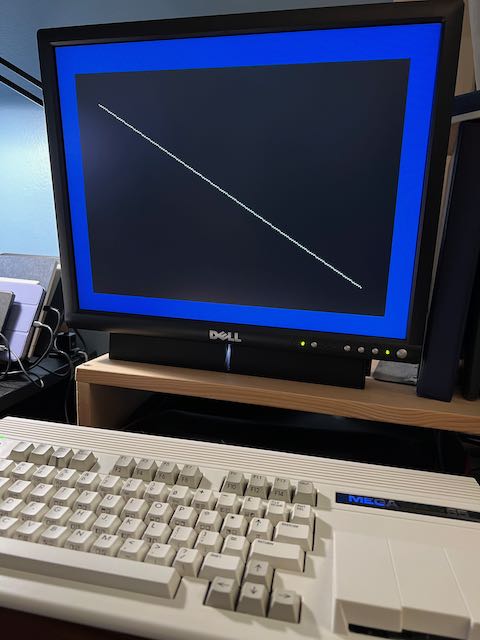 The result of a program that draws a white diagonal line on a black graphics screen