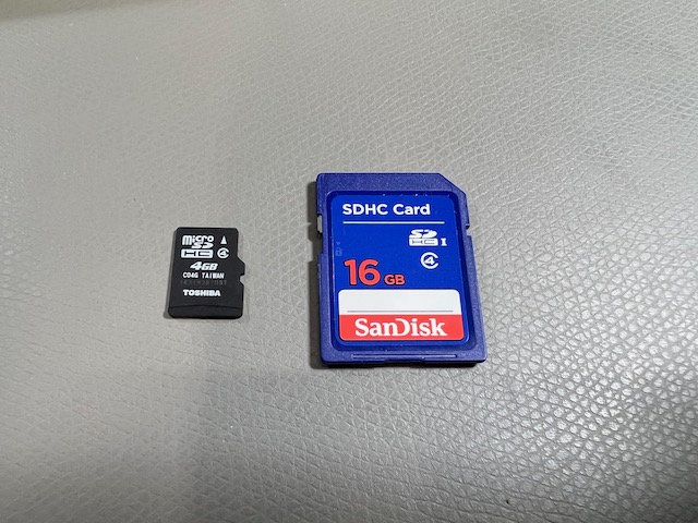 A microSD card and a full-size SD card