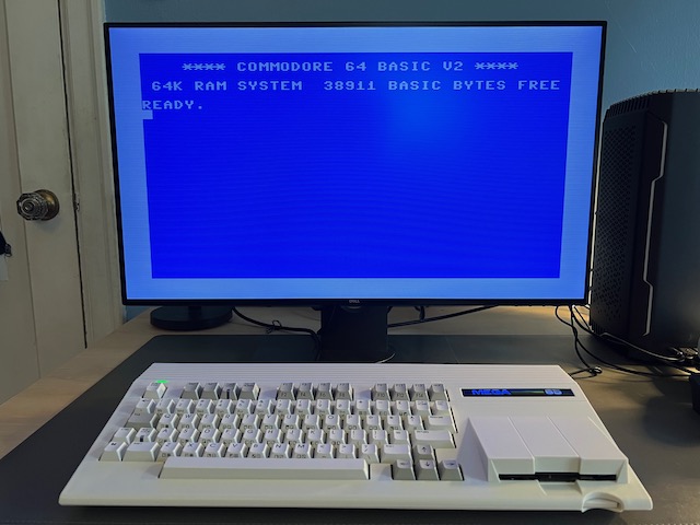 MEGA65 connected to a Dell UltraSharp 27 set to wide aspect ratio, showing C64 mode