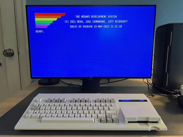 MEGA65 connected to a Dell UltraSharp 27 set to wide aspect ratio, showing BASIC